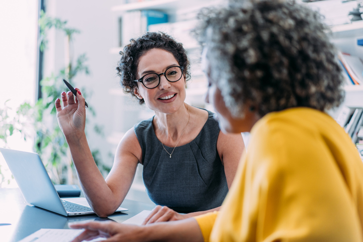 Financial advisor explaining to client how charitable remainder trusts work.